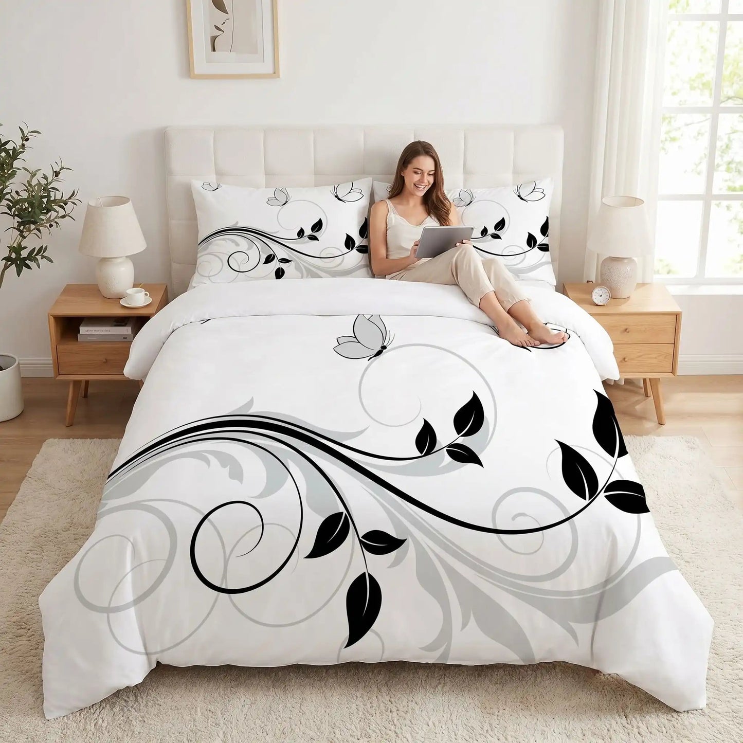 Femme avec tablette sur parure de lit blanche florale lotus zen