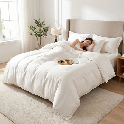 Femme endormie sur parure de lit 220x240 blanche satin luxe