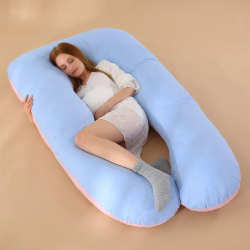 femme enceinte endormie sur traversin ergonomique bleu rose
