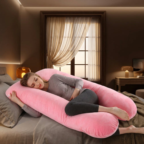 femme enceinte endormie sur traversin ergonomique rose