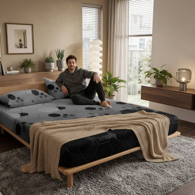  homme assis sur drap housse nuits optimales
