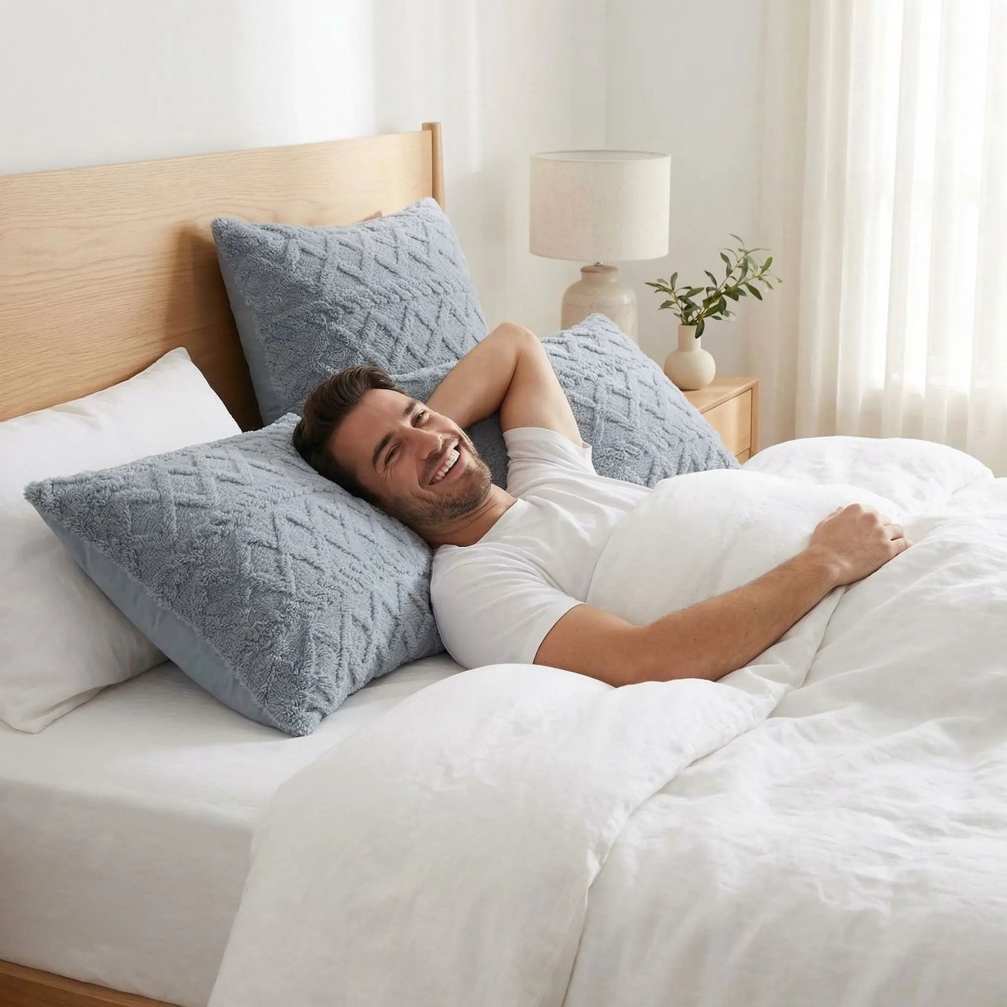 homme couché sur taie d'oreiller bleue confort durable