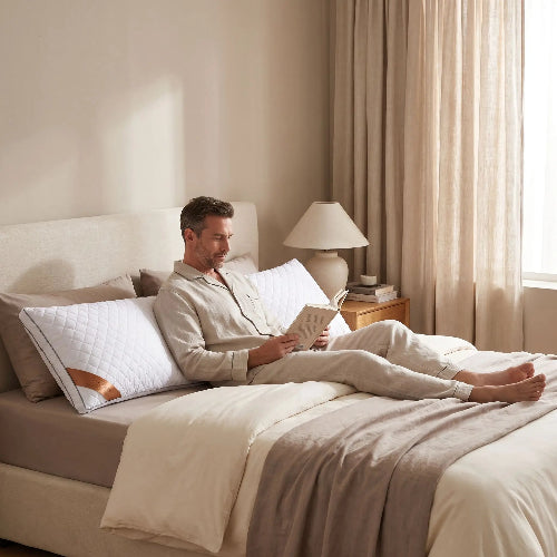 homme dos sur traversin 180 avec livre