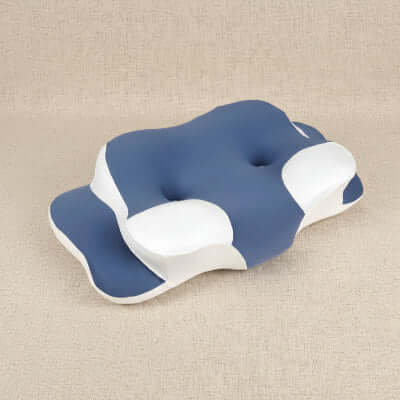oreiller à mémoire de forme bleu-blanc